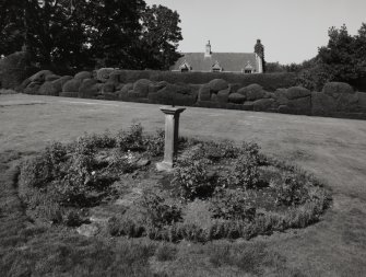 View of rose garden, sundial and hedge topiary work from West.