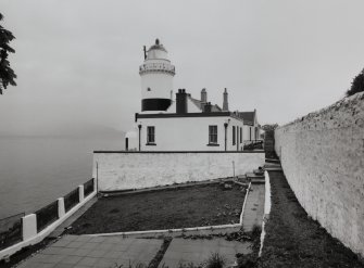 General view of lighthouse and associated buildings from S