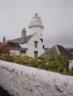 View of lighthouse and N gable of cottage from ENE