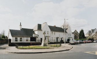 View from East showing police station, houses and war memorial