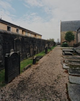 Churchyard from SW showing historic re-sited grave stones