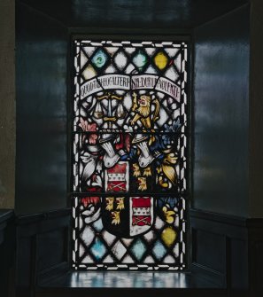 Interior. Ground floor NE aisle detail of heraldic stained glass window
