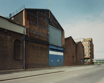 View from NNE of central part of N frontage onto East Hamilton Street, the area of the works containing Assembly and Fitting Shops, photographed 10 August 1993