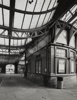 Interior.
View from West of raised portions of platform canopies where they meet the central concourse, and the rear of the semi-circular booking office.