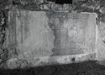 Interior, view of inscribed slab on south wall