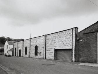 View of E facade of works fronting onto Union Street, comprising polychrome pattern of mostly white-glazed Ayrshire fireclay brick