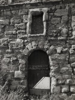 Detail of main entrance and panel above.