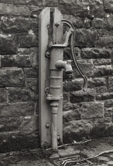 Detail of water pump in courtyard.
