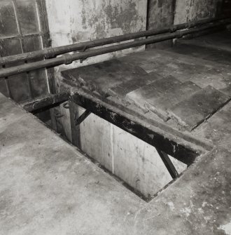 Interior.
Detail of trap door to inspection pit.