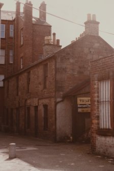 General view of rear of nos. 239-241 High Street from W.