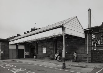 View of wooden awning on E side of Station from E