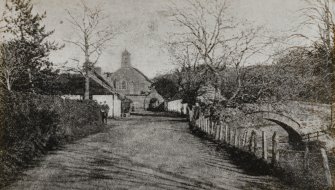 Photographic copy of postcard showing general view from W looking up towards the church.
Titled: 'Kirk-port Kirchmichael, Ayrshire'.