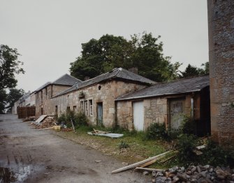 View of outbuildings from SE.