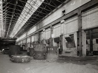 Foundry: general view from S within former casting shop, showing cast-iron stanchions supporting steel over-head crane track.  Moulten steel was previously supplied by an open-hearth furnace at the S end of the bay (now removed)