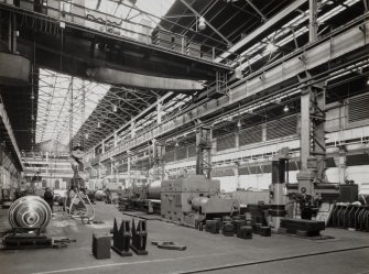 Engineering Shop: general view from S, showing roll being prepared on large grinding machine (right)