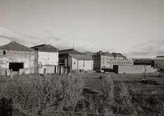 General view from SW of S side of works, including S end of (left to right) Foundry, New Moulding Bay, Dressing Shop, Engineering Shop, Turning Shop and Heat-treatment Shop, with General Stores (extreme right)