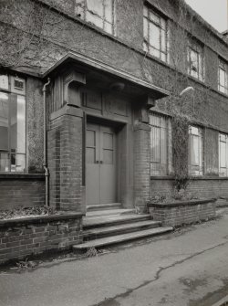 Detailed view from E of main entrance to Office building