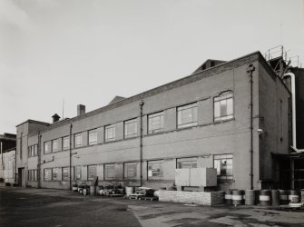 View from E along S side of block containing Dressing, Engineering, Turning and Heat-treatment Shops, the brick extensions containing a light machine shop