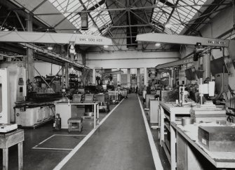 Motherwell, Craigneuk Street, Anderson Boyes
Machine Shop (Dept. 66, adjacent to Fitting Shop, built in 1942): Interior view of south end of west bay from N, showing ranges of machine tools and associated small cranes