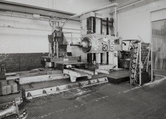 Motherwell, Craigneuk Street, Anderson Boyes
Machine Shop (Dept. 21, built 1954): Interior view from south west at east end of north bay, showing a horizontal boring machine working on the down-drive wheel-housing for a large coal-cutting machine destined for Queensland, Australia - the last machine to be made by the company in Motherwell.