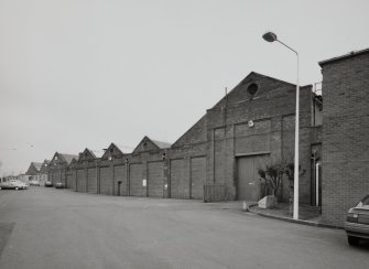 Motherwell, Craigneuk Street, Anderson Boyes
Exterior view from south west of machine shop bays, the nearest bays (right) dating from the opening of the works in 1899, the further bays originating from a sequence of expansions in 1912, 1922, 1924 and 1954