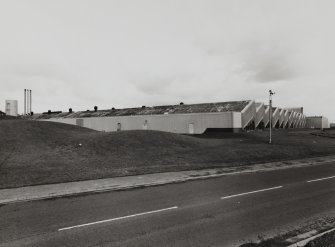 General view of factory from south, showing south east frontage (right) and south west end of the complex, with boiler house just visible (far left).