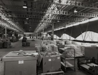 Interior view from north east within Base Engine Assembly area, with unfinished castings (engine components) in foreground.
