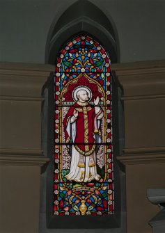 Interior. Chancel, detail of stained glass window to St. Ignatius