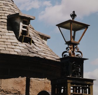 Lantern (on top of gate post) and opening for doves, detail