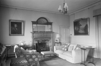 Interior view of Linhouse showing sitting room with fireplace.