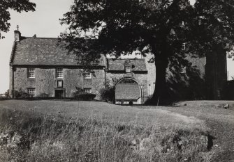 View from SE of miller's house, archway and laundry house.