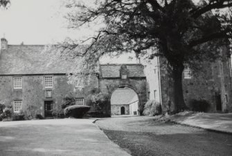 View from S of miller's house, archway and laundry block.