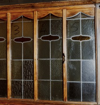 Interior.
Detail of glass panels in booth.