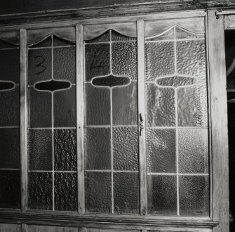 Interior.
Detail of glass panels in booth.