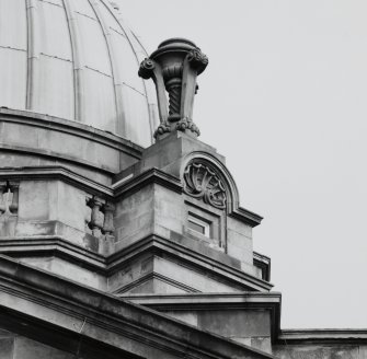 Detail of decorative urn and dormer below dome.