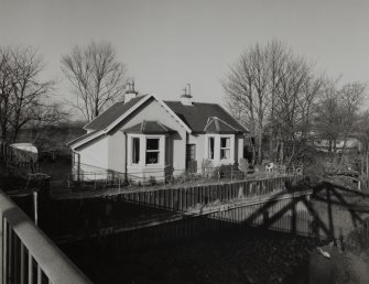 Elevated view from SE (from deck of lift bridge) showing former keeper's cottage