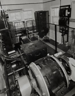 Main Control Cabin: elevated interior view from E showing electrically driven lifting mechanism [driven by a 3-phase 400 volt 50 horse-power induction motor made by Metropolitan Vickers of Manchester and Sheffield, and the electrical equipment by 'I Granic of London, Bedford'