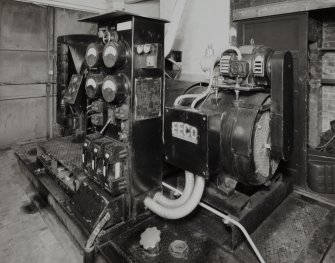 Out-house: view of back-up diesel-powered generator situated in basement, showing (right) Brush of Loughborough 3-phase 400 volt generator (made in 1948), driven by engine made by AEC of Southall