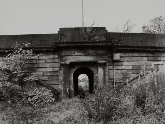 Detail of arched passageway through bridge from S.