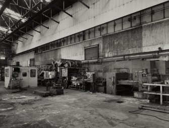 Interior.
View of flash spot welder at beginning of pickle line.