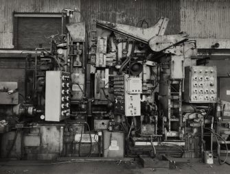 Interior.
View of flash spot welder at beginning of pickle line.