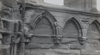 Detail of arcade carving on E gable.