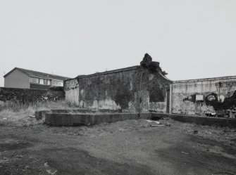 View of remains of greenhouse.