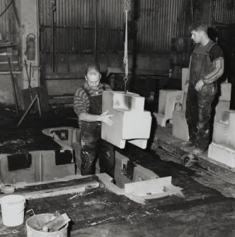 View of moulding pit, showing preparation and insertion of cores