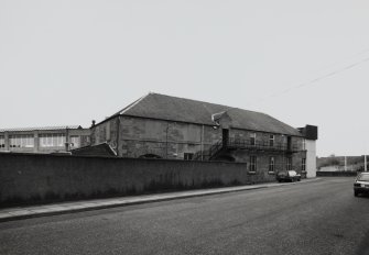 View from N of redstone two-storeyed building, to rear of main Office block in Wellgate