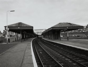 General view of station from N end of platforms, showing canopies and rear of main station offices.