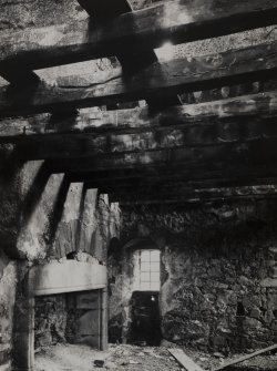 Braikie Castle. Interior.
View of hall showing fireplace, painted beams and partition above.
