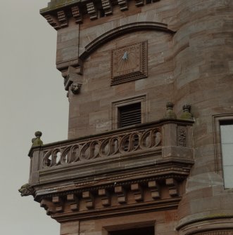 Detail of balcony and sundial on S facade.