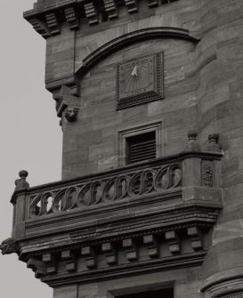 Detail of balcony and sundial on S facade.