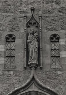 Detail of statue of Saint Mary over main entrance.